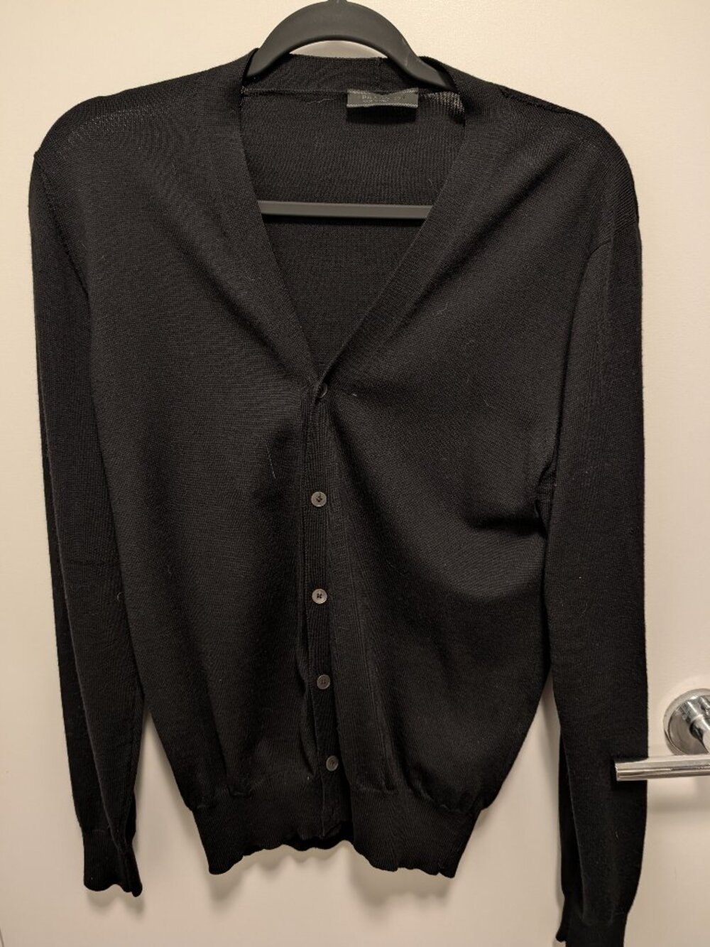 Authentic Prada 100% virgin wool cardigan in black.